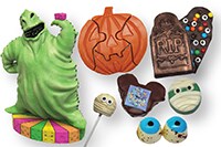 An assortment of Disney Halloween themed treats, including one shaped like Oogie Boogie