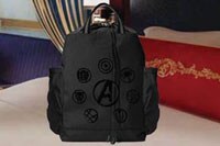 Pack for your journey with an awesome Avengers backpack! A Disney Cruise Line stateroom with an Avengers backpack on the bed