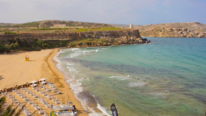 Lounge chairs on a sandy beach on Malta